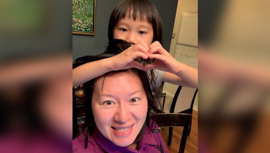 Dr. Paula Tchen with her child joins the OMF gala event via Zoom.