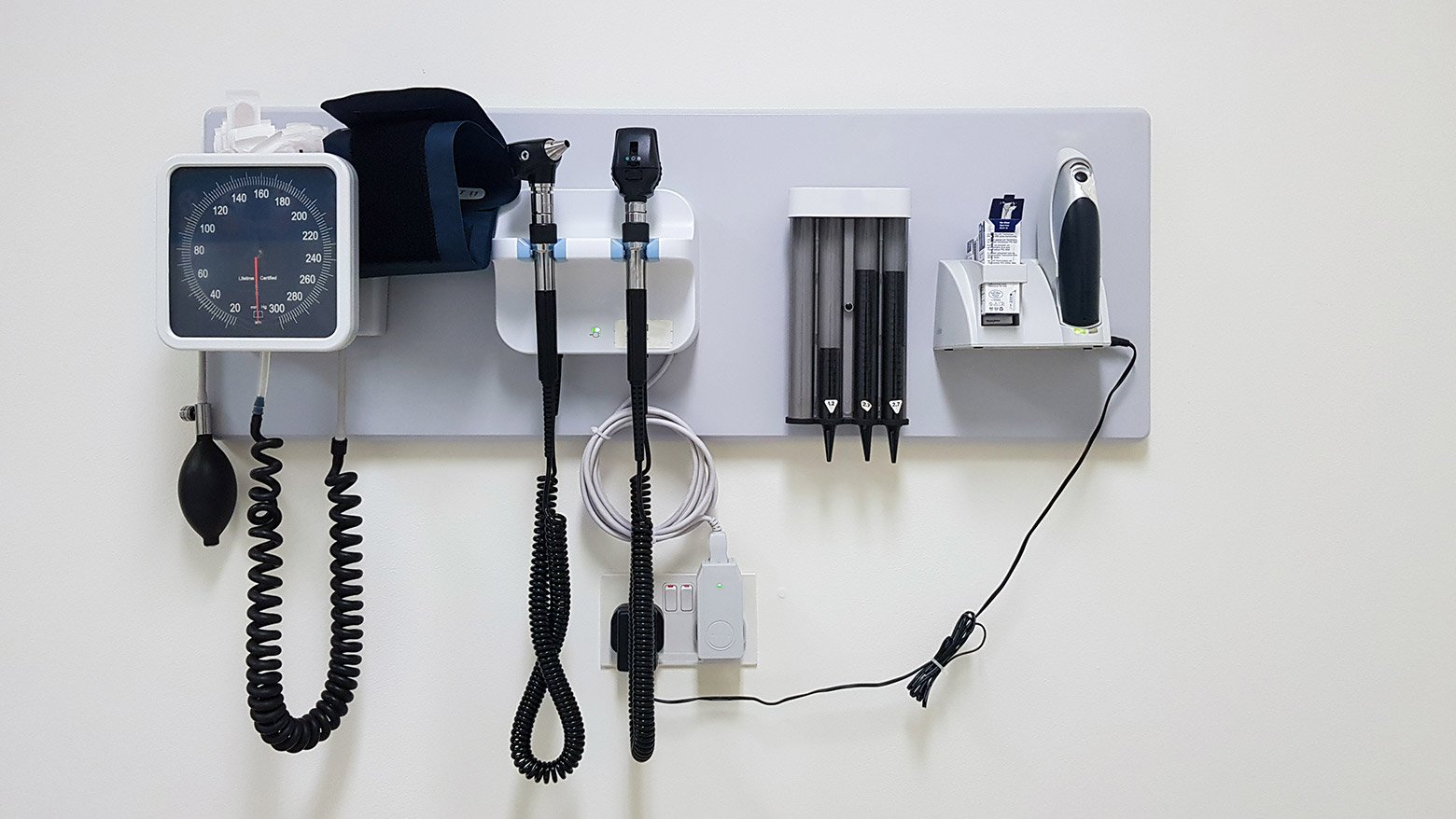 Examination room equipment mounted on a wall
