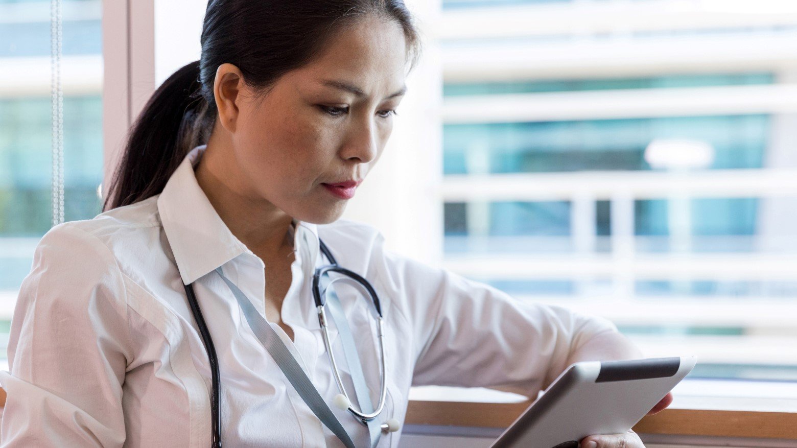 female doctor using a tablet