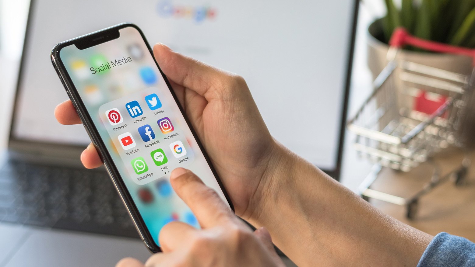 Someone uses an iPhone to look at their social media apps