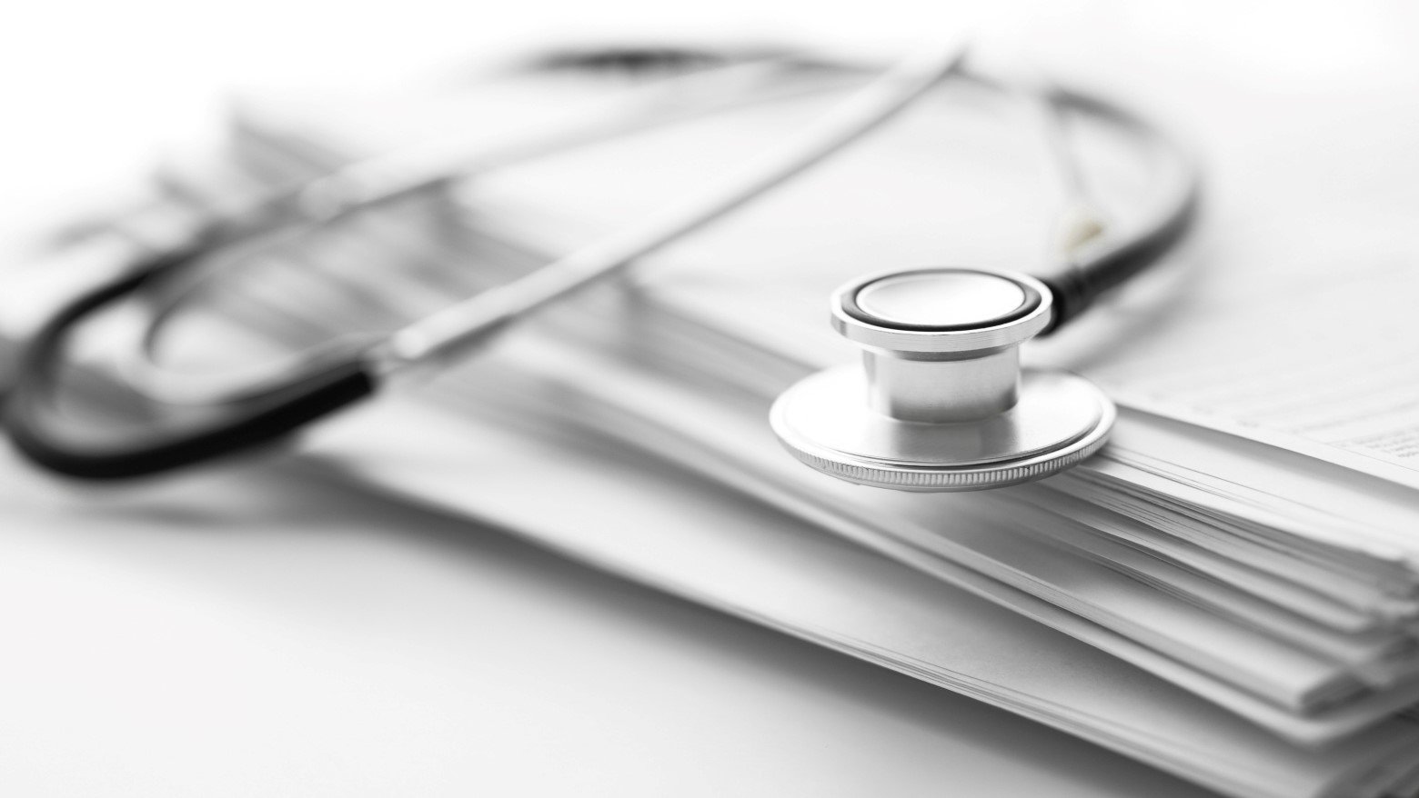 stethoscope on top of files