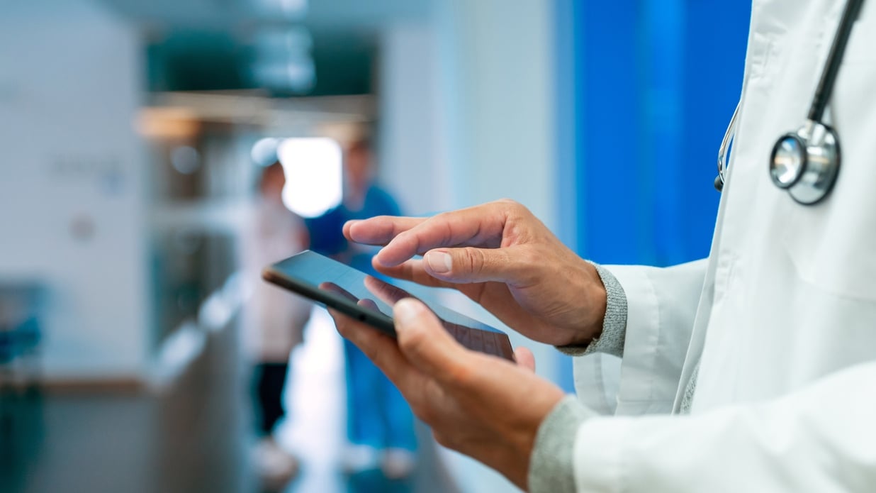 Close-up on a doctor using a digital tablet at the hospital.