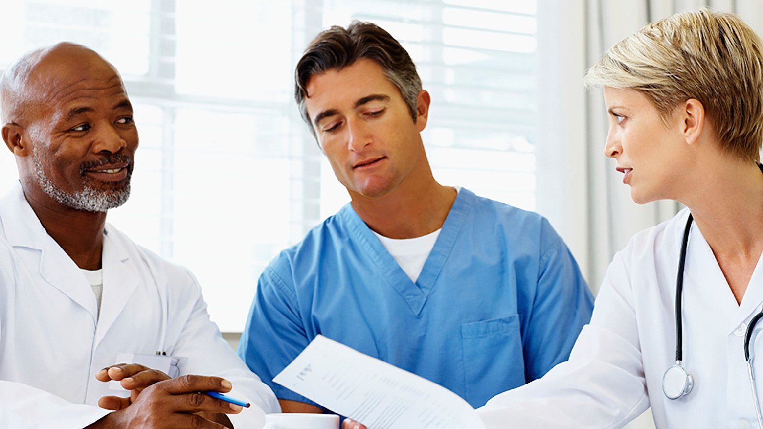Three doctors discuss paperwork