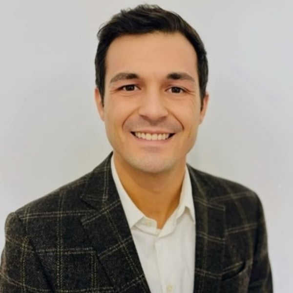 A headshot of Adam Jeronimo is seen here.