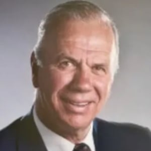 A headshot of Dr. Wilbur Howard Harris is seen here.