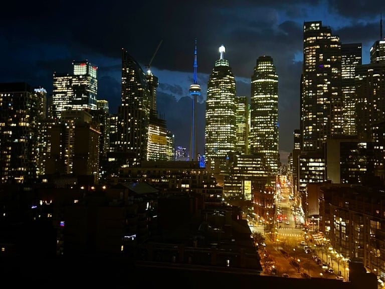 Toronto's CN Tower appears in blue light
