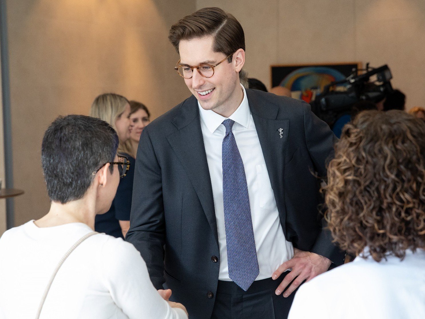 OMA President Dr. Dominik Nowak shakes a person's hand during a visit to Mount Sinai hospital in Toronto