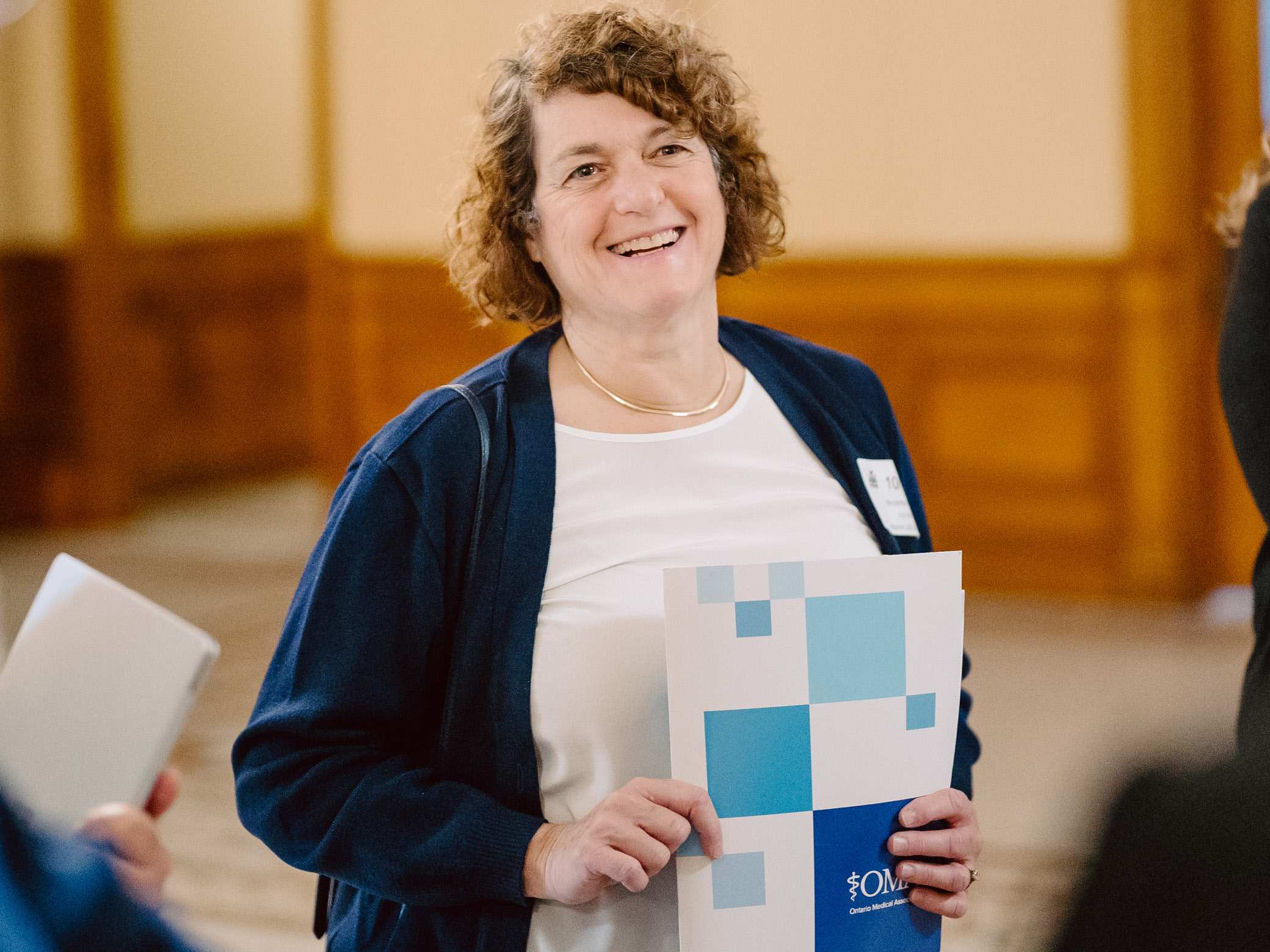  Dr. Nicolette Fellegi, a family physician from Ottawa, holding OMA literature.