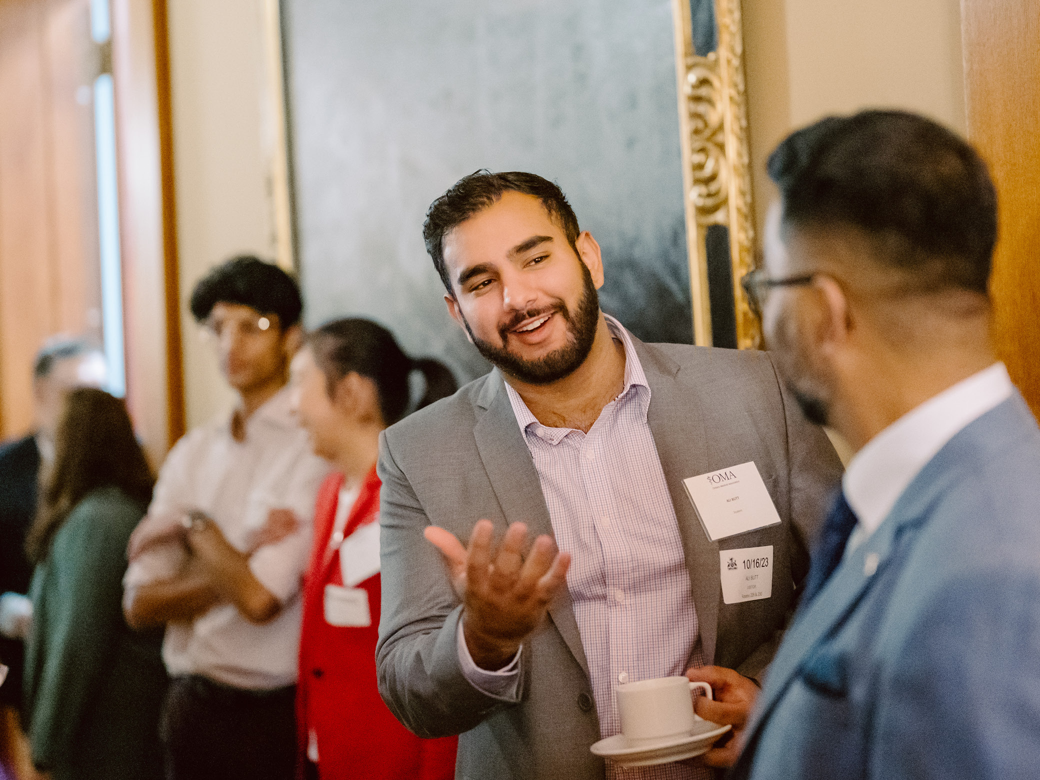 Medical student Ali Butt has a conversation with OMA members.