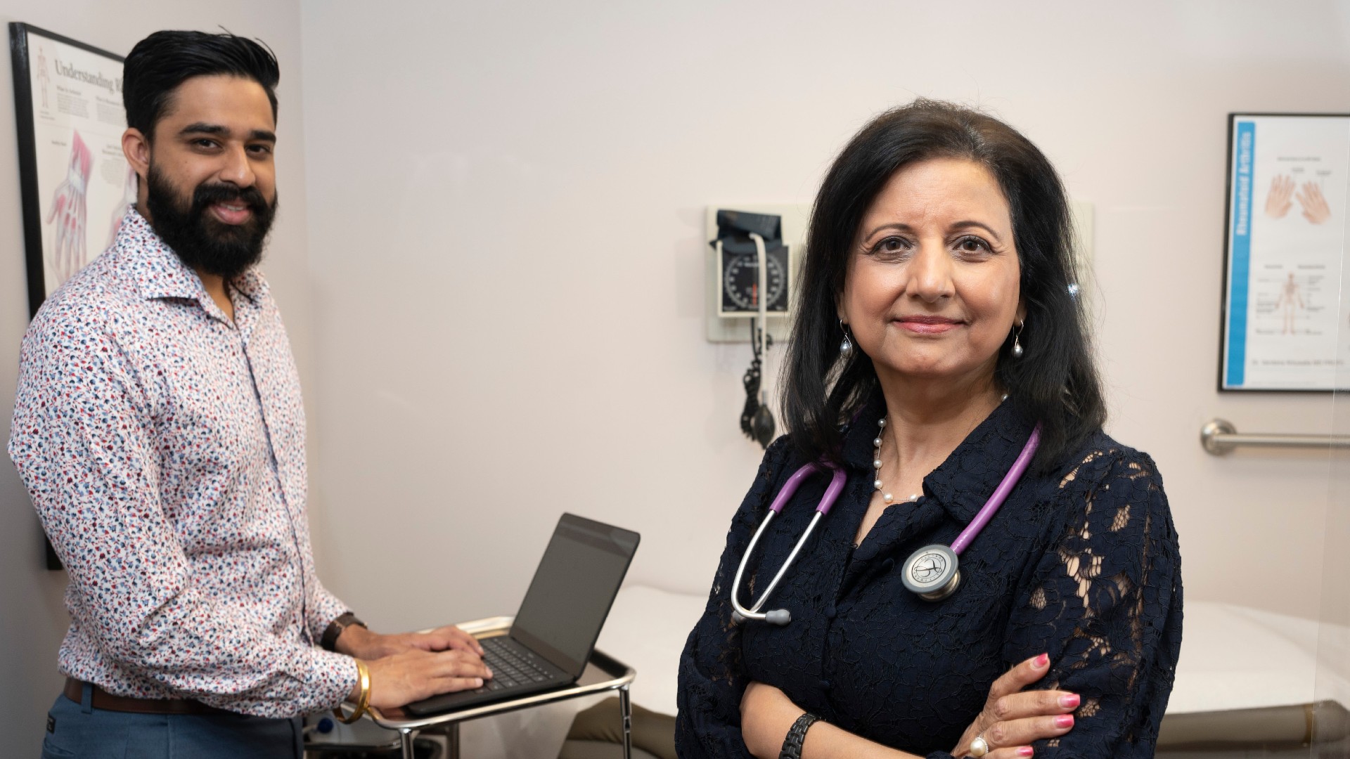 Dr. Vandana Ahluwalia in her office with a medical scribe