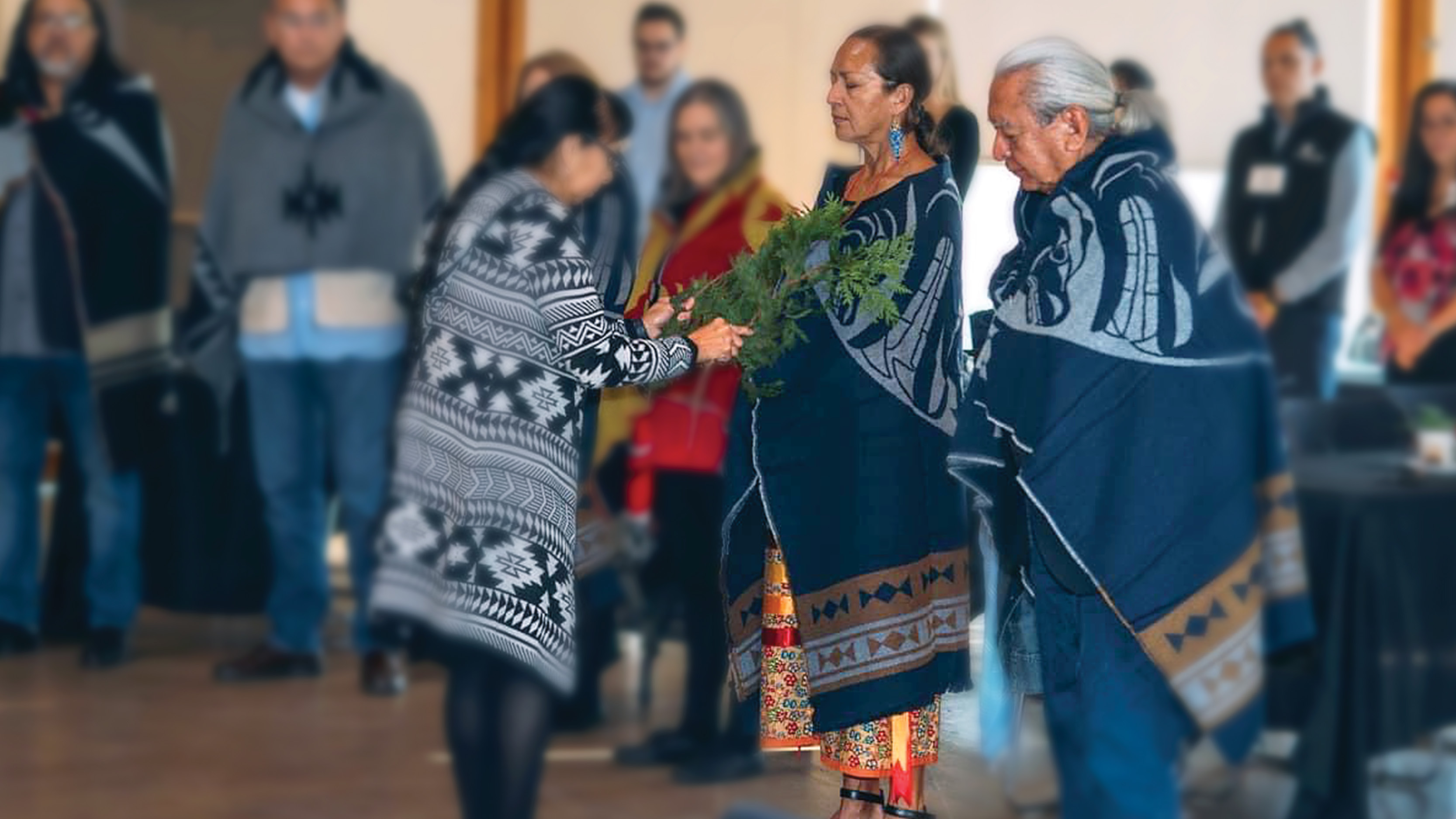 Dr. Nel Wieman and Elder Gerry Oleman are blanketed in a recent ceremony celebrating their work as co-chairs of the Technical Committee that developed the first provincial Cultural Safety and Humility Standard in B.C.